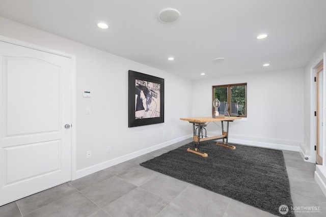 tiled foyer with recessed lighting and baseboards