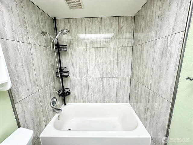 full bath with shower / bathtub combination, toilet, and visible vents