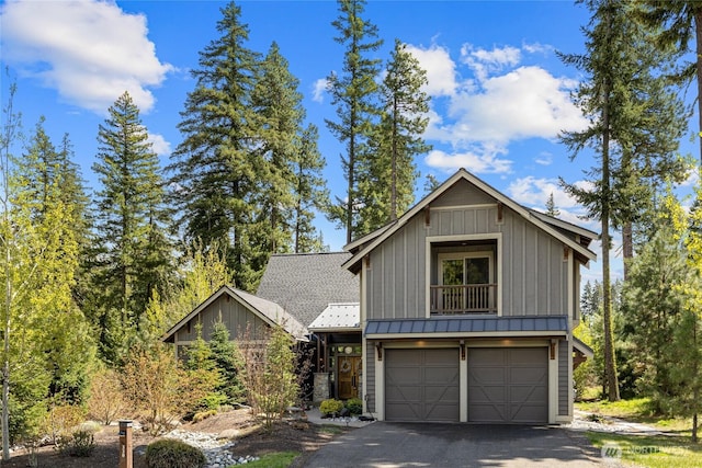 330 Maple Leaf Loop, Cle Elum, WA 98922 - view of front of property with a garage, a standing seam roof, board and batten siding, metal roof, and driveway
