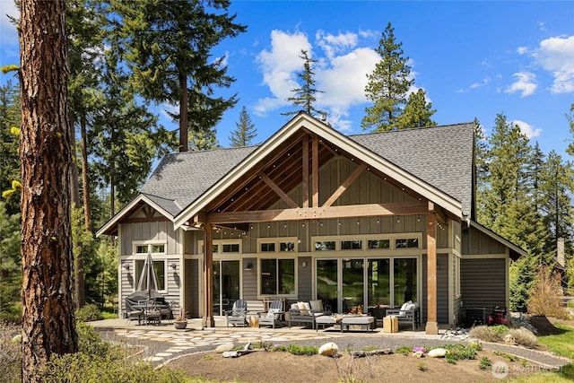 330 Maple Leaf Loop, Cle Elum, WA 98922 - back of property with board and batten siding, a patio area, and roof with shingles