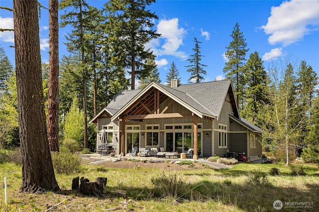 330 Maple Leaf Loop, Cle Elum, WA 98922 - rear view of house with roof with shingles, board and batten siding, a chimney, and a patio area