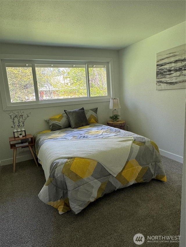 bedroom featuring carpet floors and baseboards