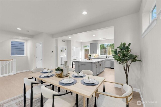 dining area with recessed lighting, baseboards, and light wood-style flooring