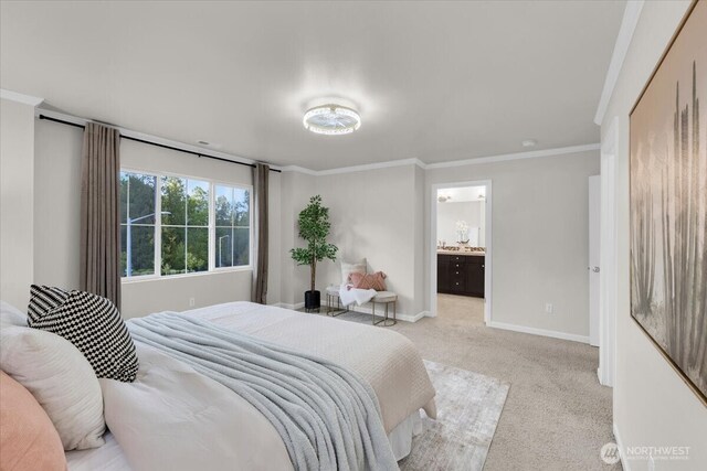 bedroom with crown molding, baseboards, ensuite bath, and light carpet