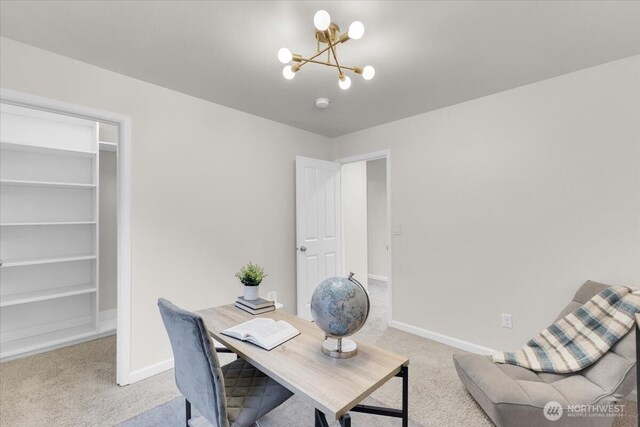 carpeted office featuring baseboards and a notable chandelier