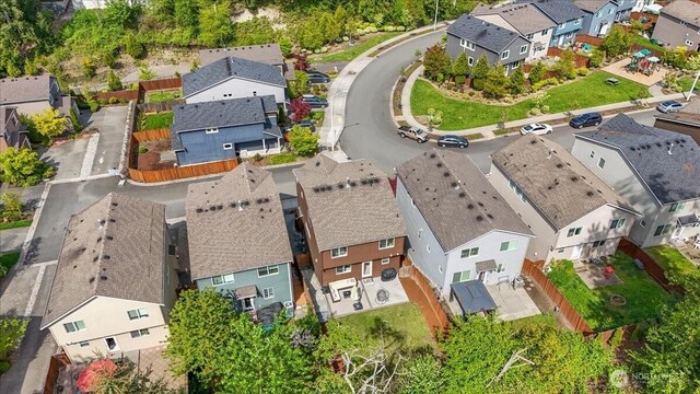birds eye view of property with a residential view