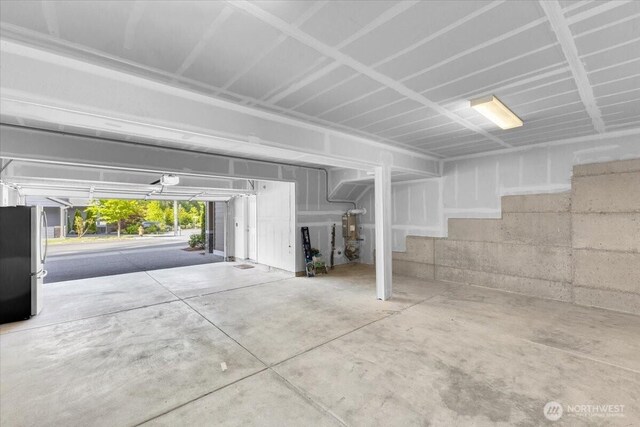 garage with freestanding refrigerator