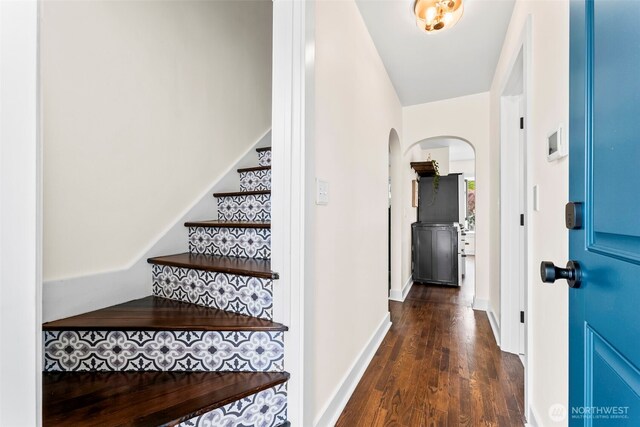4215 N 27th St, Tacoma, WA 98407 - entryway with arched walkways, dark wood finished floors, and stairway