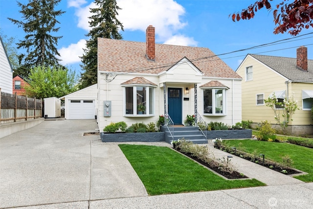 4215 N 27th St, Tacoma, WA 98407 - view of front facade with a chimney, roof with shingles, a front yard, fence, and concrete driveway