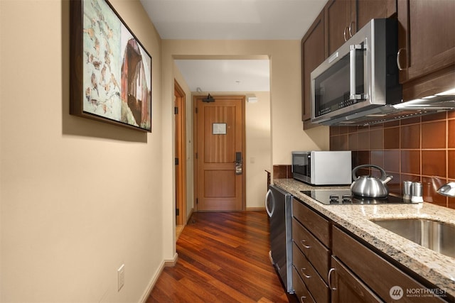 3600 Suncadia Trl Unit 3020, Cle Elum, WA 98922 - kitchen with tasteful backsplash, dark wood finished floors, baseboards, light stone counters, and stainless steel microwave