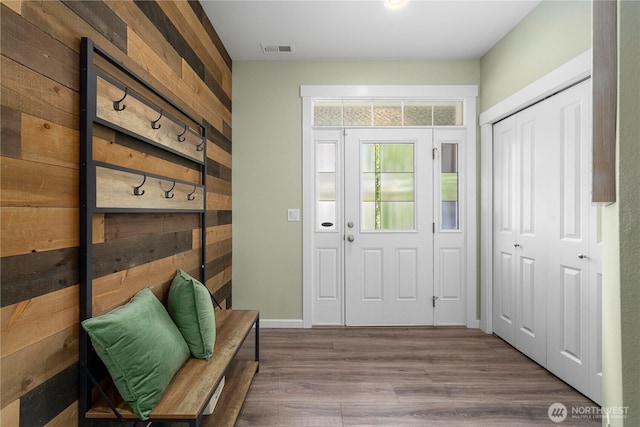 mudroom with wood finished floors