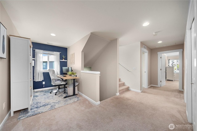 office space featuring light carpet, baseboards, and recessed lighting