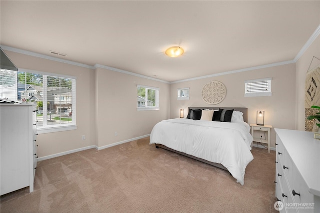 bedroom with crown molding, light carpet, and baseboards