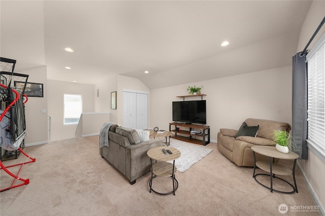 living room with light colored carpet, lofted ceiling, recessed lighting, and baseboards