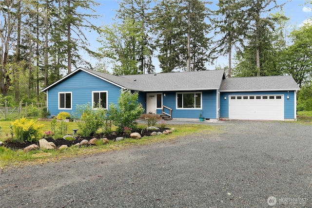 15627 240th St E, Graham, WA 98338 - single story home with an attached garage, driveway, and a shingled roof