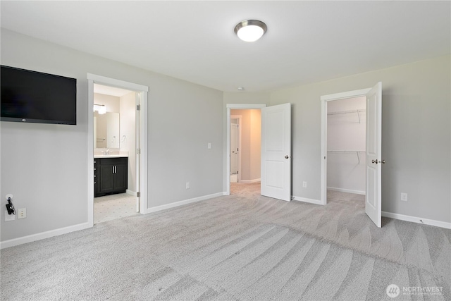 15627 240th St E, Graham, WA 98338 - unfurnished bedroom featuring light colored carpet, a spacious closet, and baseboards