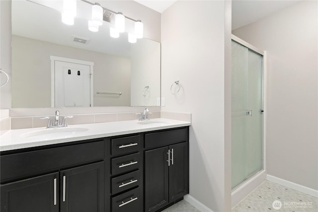 15627 240th St E, Graham, WA 98338 - bathroom with double vanity, a stall shower, and baseboards