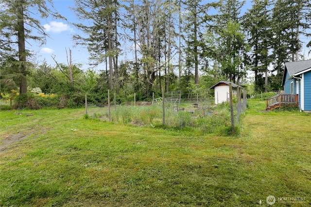 15627 240th St E, Graham, WA 98338 - view of grassy yard with a deck