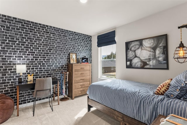 bedroom featuring carpet flooring and brick wall