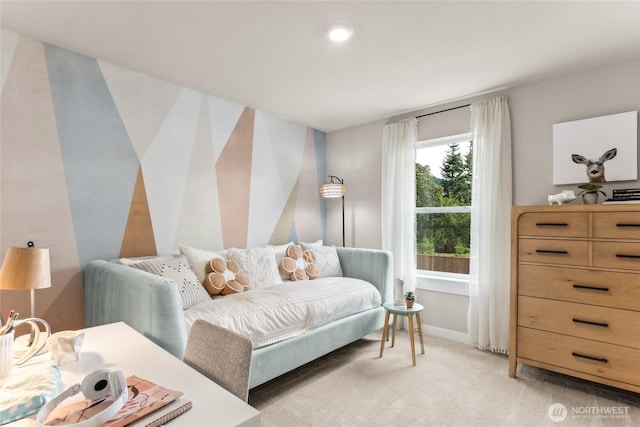 bedroom with baseboards and light carpet