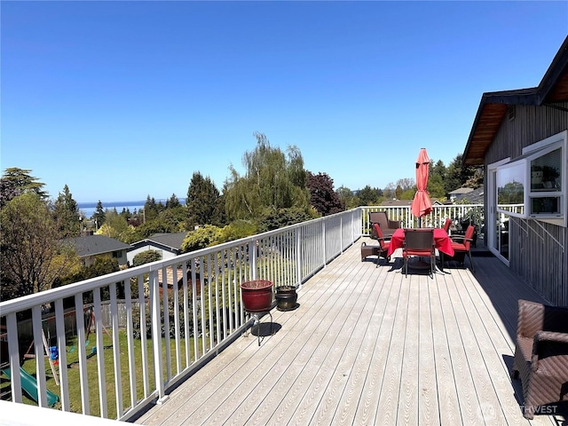 wooden terrace with outdoor dining area