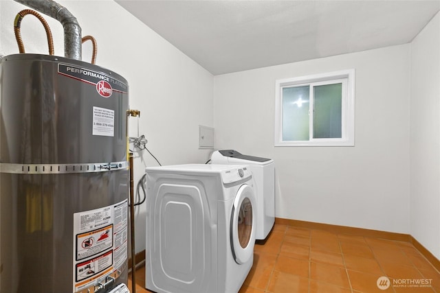 431 12th Pl N, Edmonds, WA 98020 - washroom featuring strapped water heater, independent washer and dryer, baseboards, and tile patterned flooring
