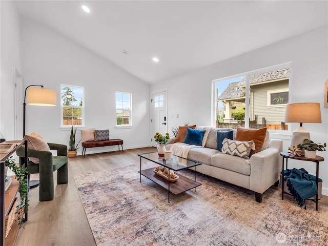 7822 Beverly Blvd Unit B, Everett, WA 98203 - living room with healthy amount of natural light, wood finished floors, recessed lighting, baseboards, and high vaulted ceiling