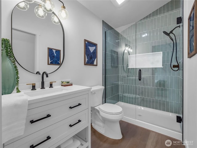 7822 Beverly Blvd Unit B, Everett, WA 98203 - bathroom featuring vanity, toilet, a shower stall, wood finished floors, and a chandelier