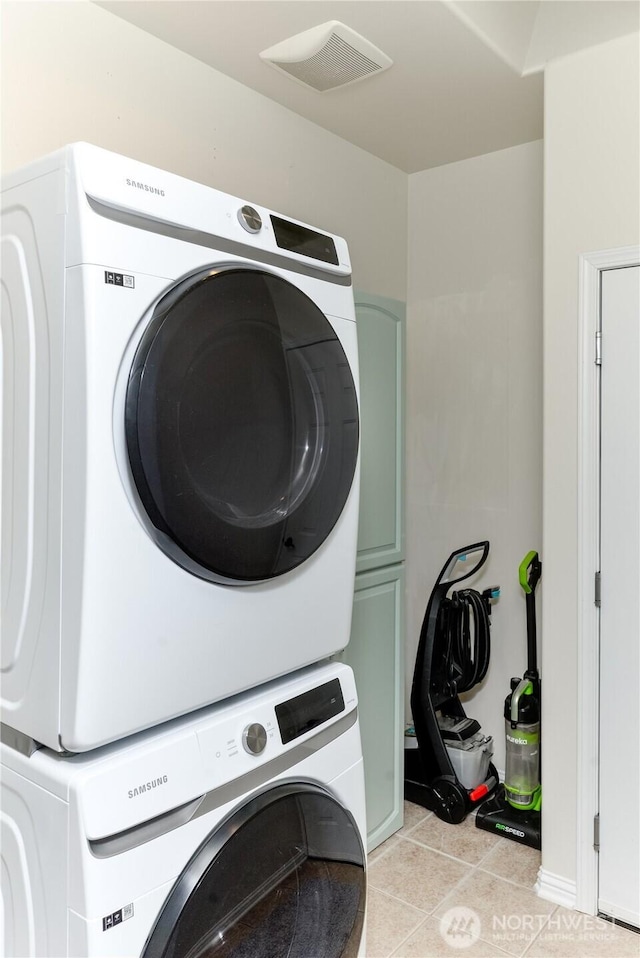 2605A Plum Ct Unit A, Port Angeles, WA 98363 - clothes washing area featuring light tile patterned floors, laundry area, stacked washer and dryer, and visible vents