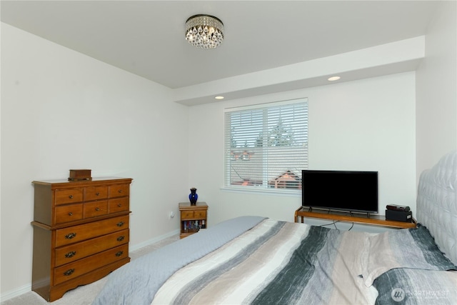 2605A Plum Ct Unit A, Port Angeles, WA 98363 - bedroom with carpet flooring, baseboards, and an inviting chandelier