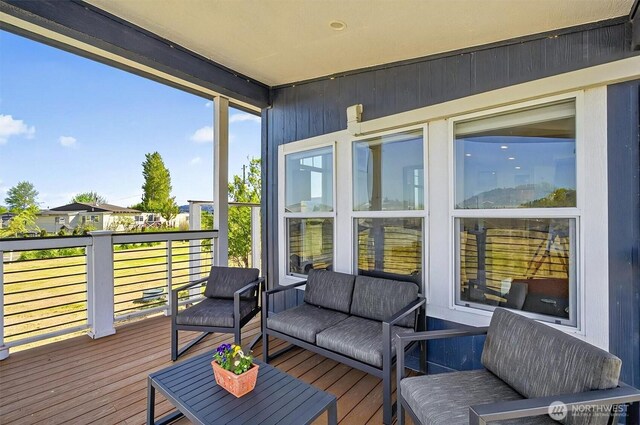 sunroom / solarium with an outdoor living space