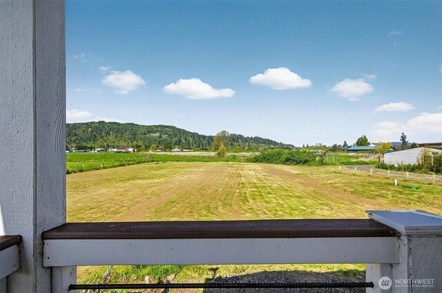 view of yard with a rural view