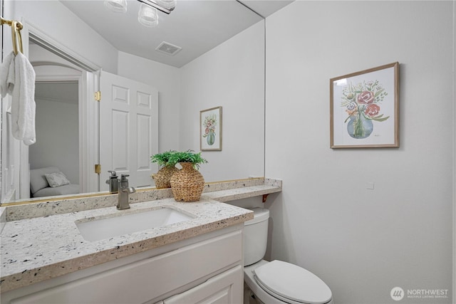 half bath with toilet and vanity