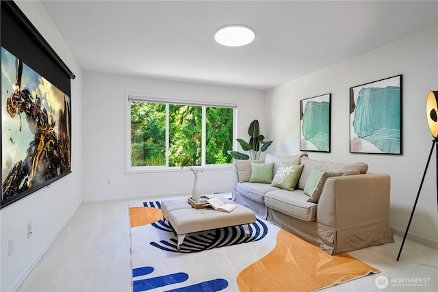 carpeted living room with baseboards