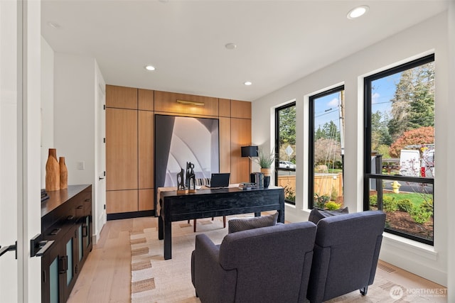 office featuring recessed lighting, light wood finished floors, and visible vents