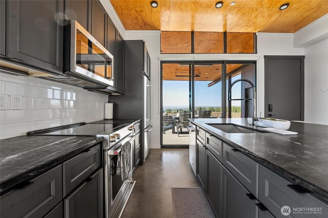 23654 Gorge View Loop NW, Quincy, WA 98848 - kitchen featuring finished concrete flooring, tasteful backsplash, wood ceiling, and stainless steel appliances
