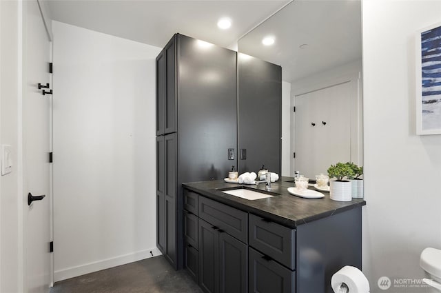 23654 Gorge View Loop NW, Quincy, WA 98848 - bathroom with vanity, toilet, baseboards, recessed lighting, and finished concrete floors