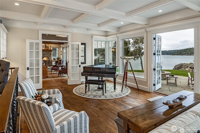 sunroom / solarium with beamed ceiling, french doors, hardwood / wood-style flooring, and coffered ceiling