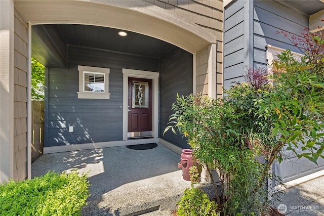 property entrance featuring covered porch