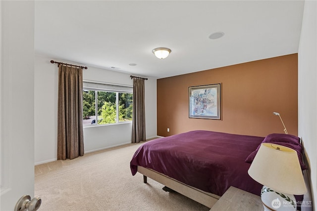 carpeted bedroom with baseboards