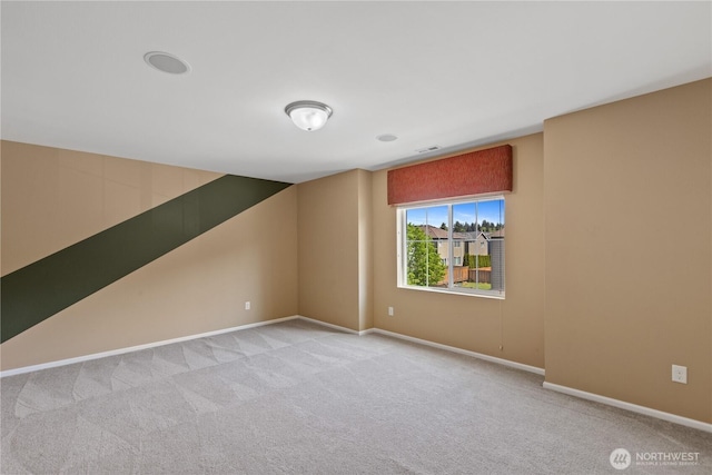 additional living space featuring carpet flooring and baseboards