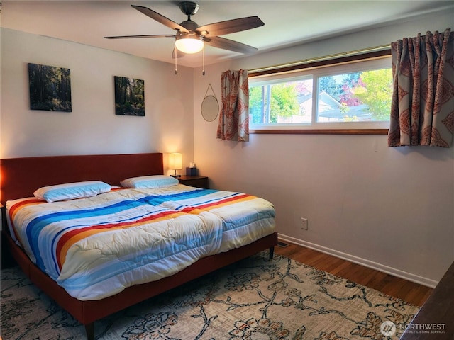 11515 7th Ave NE, Seattle, WA 98125 - bedroom with baseboards, ceiling fan, and wood finished floors