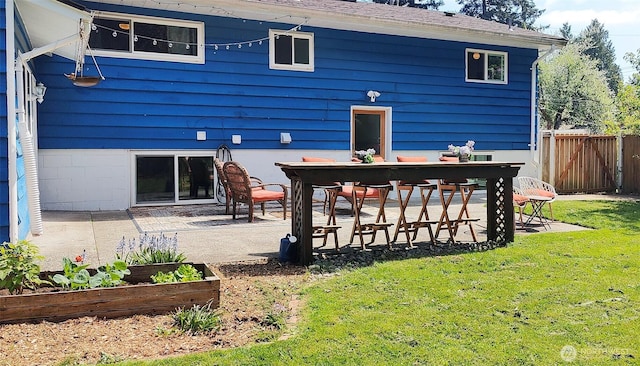 11515 7th Ave NE, Seattle, WA 98125 - rear view of house with fence, a yard, a garden, and a patio area
