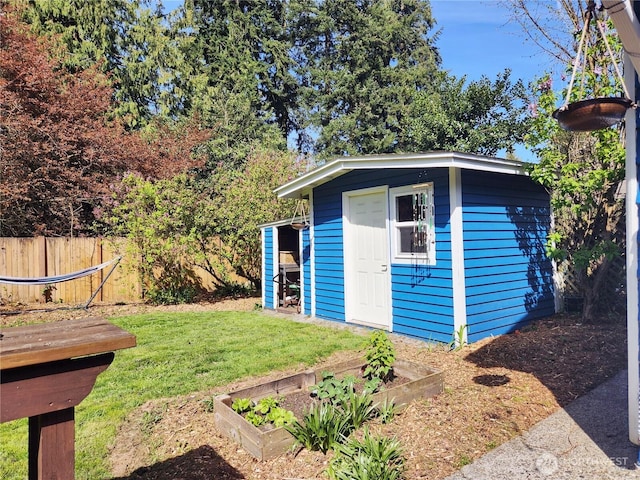 11515 7th Ave NE, Seattle, WA 98125 - view of shed featuring fence and a garden