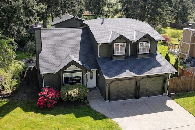 view of front of home with concrete driveway, a chimney, and roof with shingles