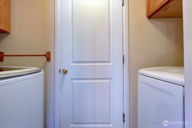 laundry area featuring cabinet space