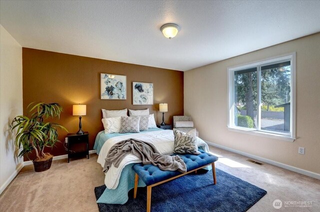 bedroom with carpet and baseboards