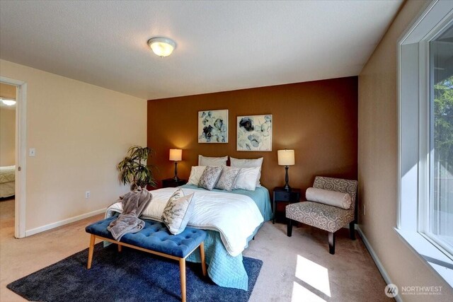 carpeted bedroom with baseboards