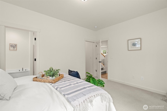 carpeted bedroom with baseboards