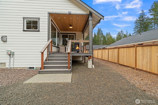 exterior space featuring stairway, a deck, and fence